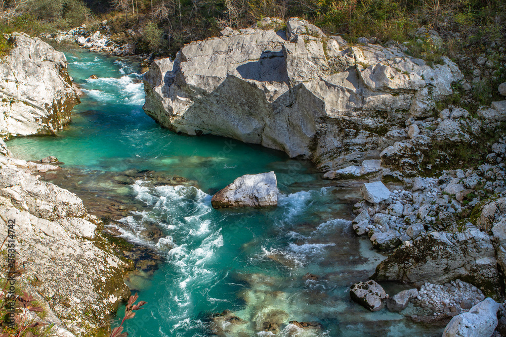 Kobarid, Slovenia - October 28, 2014: The Soca river flows through western Slovenia and its source lies in the Julian Alps. One of the most beautiful rivers in Europa, known for its emerald color.