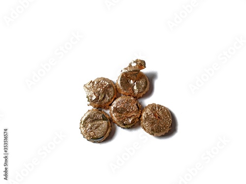 Beer caps with golden foil on white background
