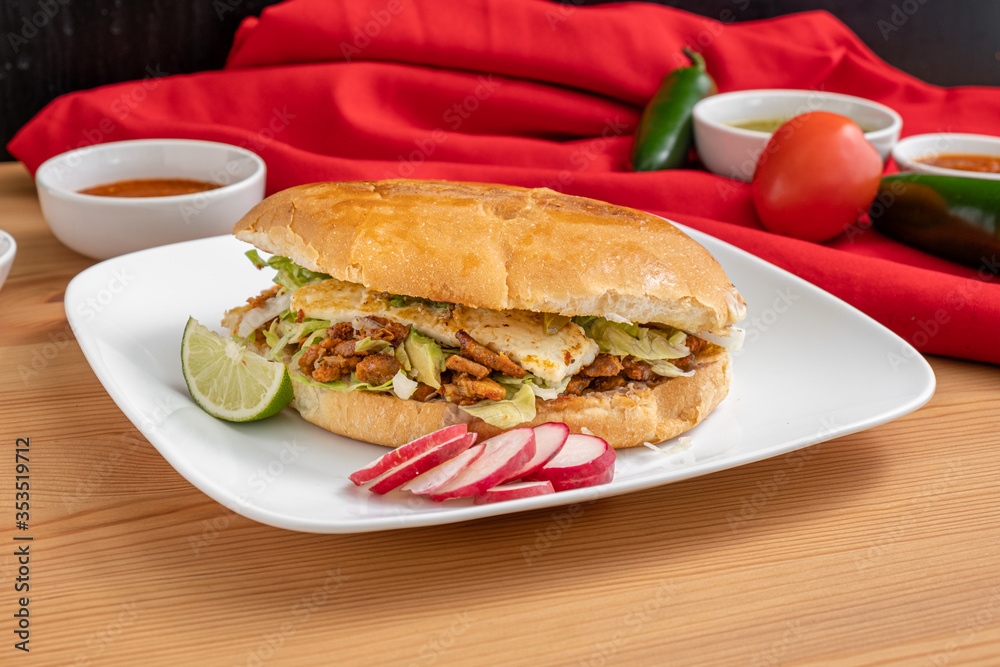 Authentic Mexican torta. A sandwich from Mexico made with fresh bread and spicy chicken. Authentic Mexican torta. A sandwich from Mexico made with fresh bread and spicy chicken.