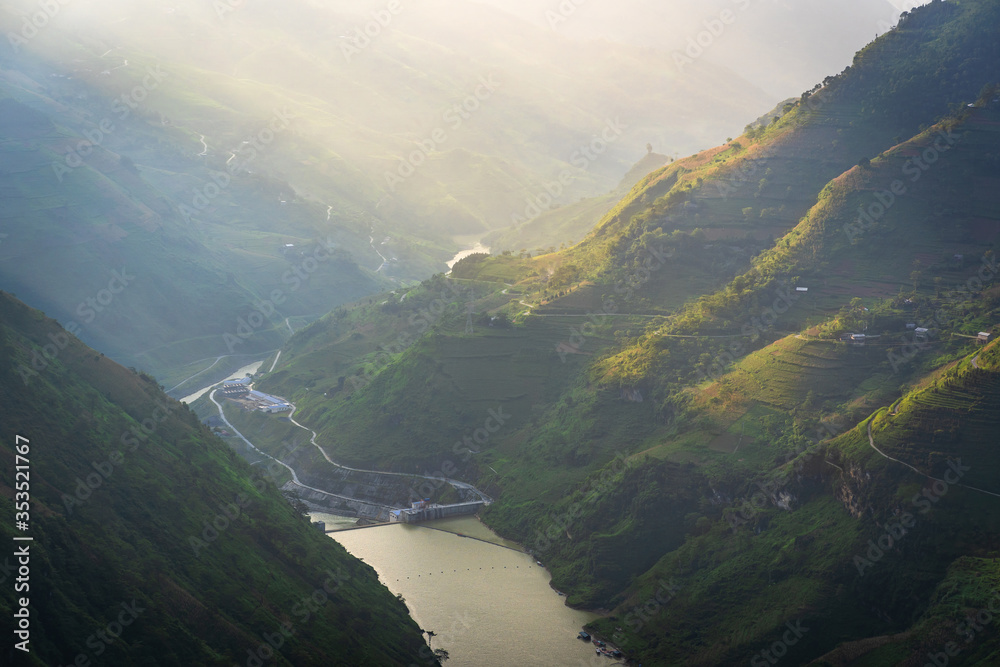 Beautiful morning light at water dams hydroelectric power station of Nho Que river surrounded by mountains during foggy from the Ma Pi Leng pass, Dong Van Geopark, Ha Giang, Northern Vietnam