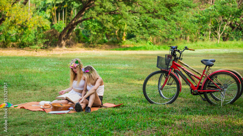 Happy young woman having picnic with friend