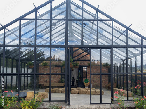 Empty greenhouse glass structure building front view photo