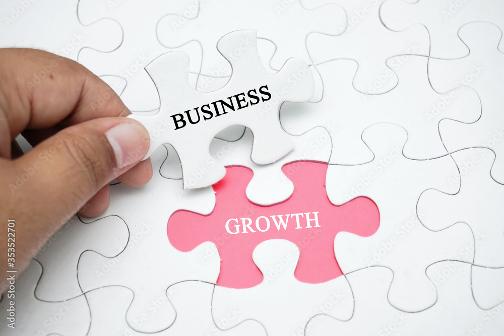 Missing puzzle with a word BUSINESS GROWTH. Business concept puzzle piece. Business and finance concept. Missing puzzle with a word BUSINESS GROWTH. Business concept puzzle piece. Business and finance concept.