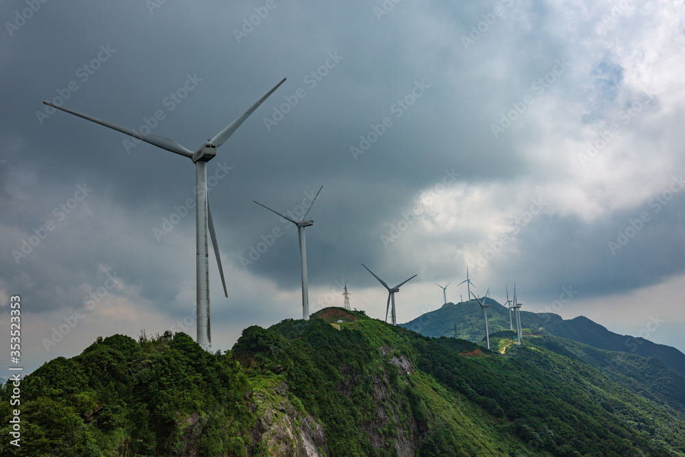 Windmill in the rainy season in the missing mountain in Heyuan, Guangdong, China