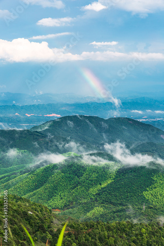 Beautiful rainbow on the mountain after summer rain