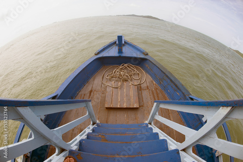 View from the head of a local fishing boat in the sky-sea and summer island in Thailand.. photo