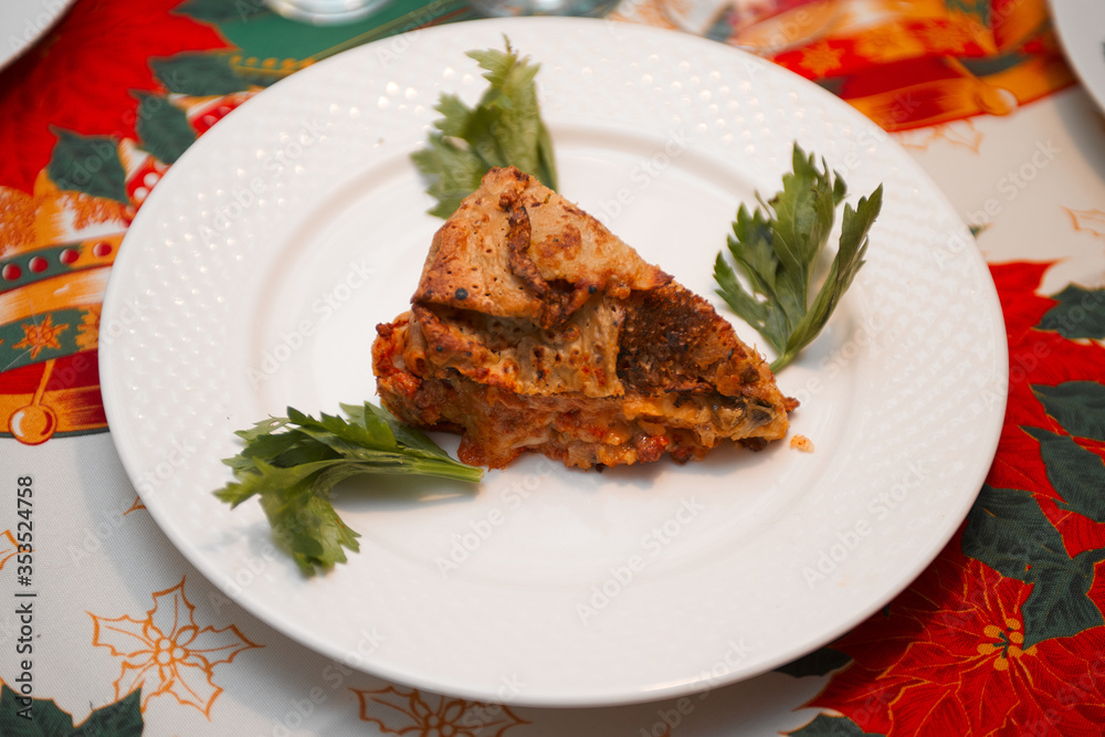 Close up of timballo slice on a dish