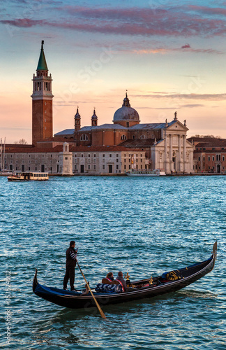 Venice at sunset, with gondols in the canals