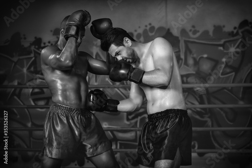 diverse boxing fighters fighting on ring in champion match