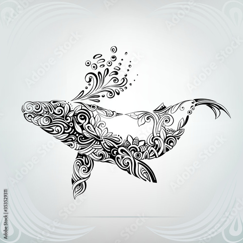 A silhouette of whale is in a decorative pattern