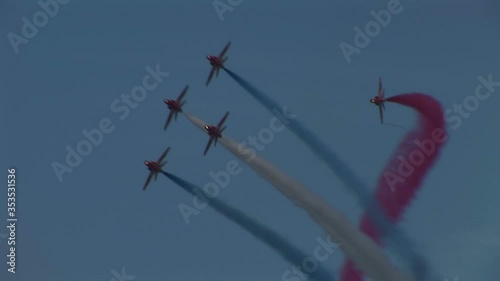 Air display in airshow with jet planes and smoke red, white and blue photo