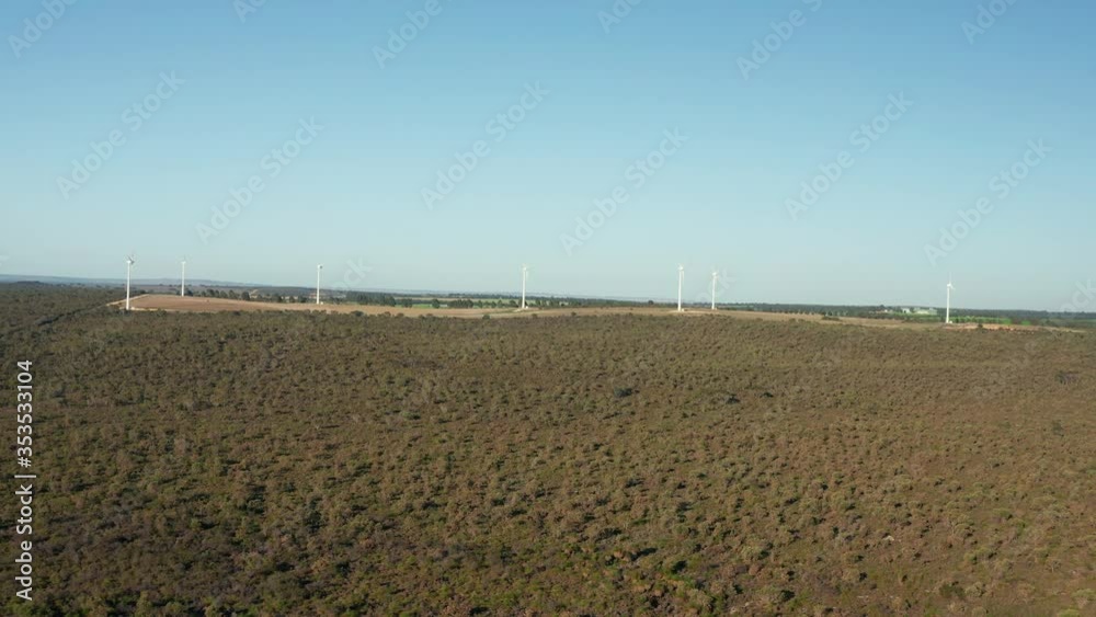 Flying across scrubland towards a wind farm in Western Australia. Flying across scrubland towards a wind farm in Western Australia.