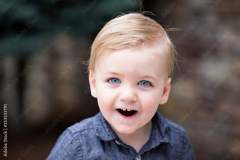 Excited little boy face with mouth open and cute gap between front teeth Excited little boy face with mouth open and cute gap between front teeth