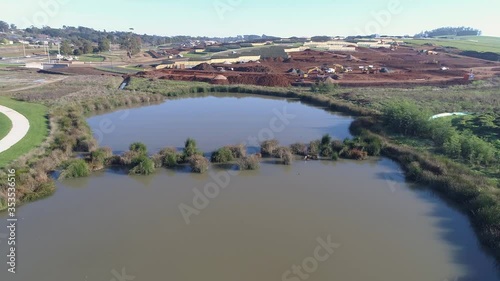 man made lake beside new subdivision photo