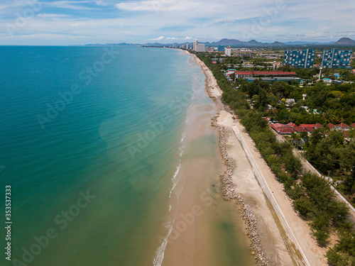Aerial view of Landscape of downtown or Cha-Am City between Beach and Tropical tree on Cha-Am beach, Thailand. ,drone's view. Cha-am beach are deserted during the CoronaVirus outbreak. covid-19