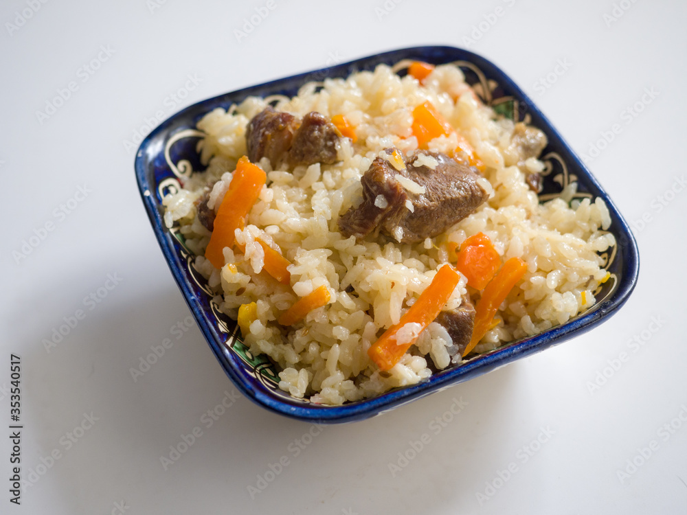 Pilaf in a national oriental bowl. Asian traditional dish Pilaf in a national oriental bowl. Asian traditional dish