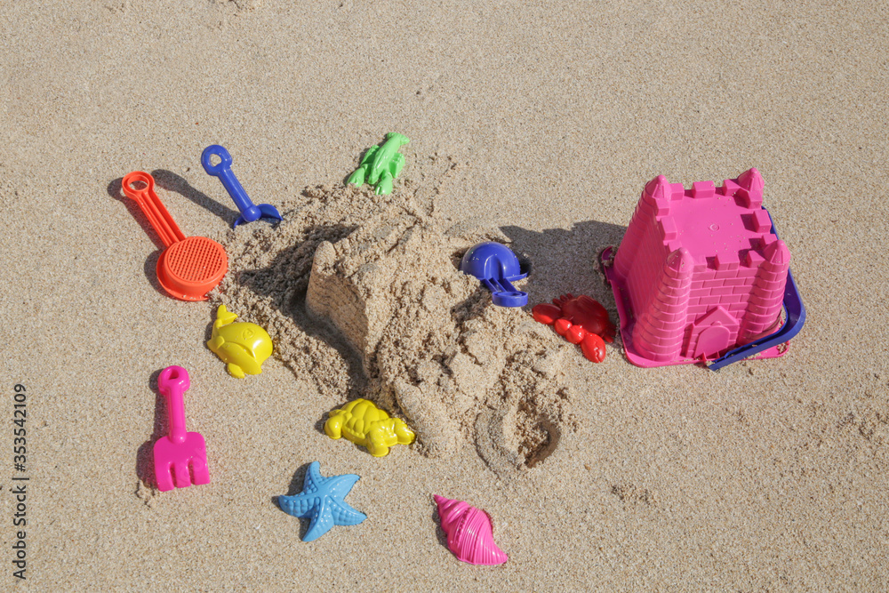 Plastic children toys on the sand beach. Plastic children toys on the sand beach.