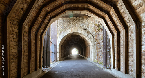 tunnel with wood architecture and light at the end