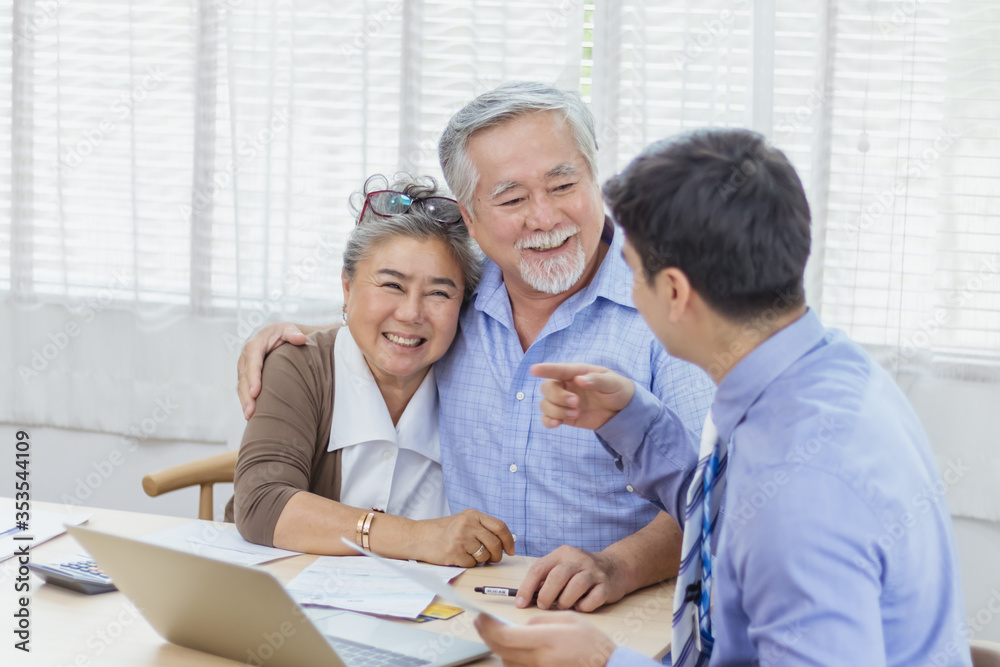 Happy retired Asian senior eldery couple consult with personal financial advisor or real estate agent. Retirement investment planning with professional counseling. Home loan and mortgage concept