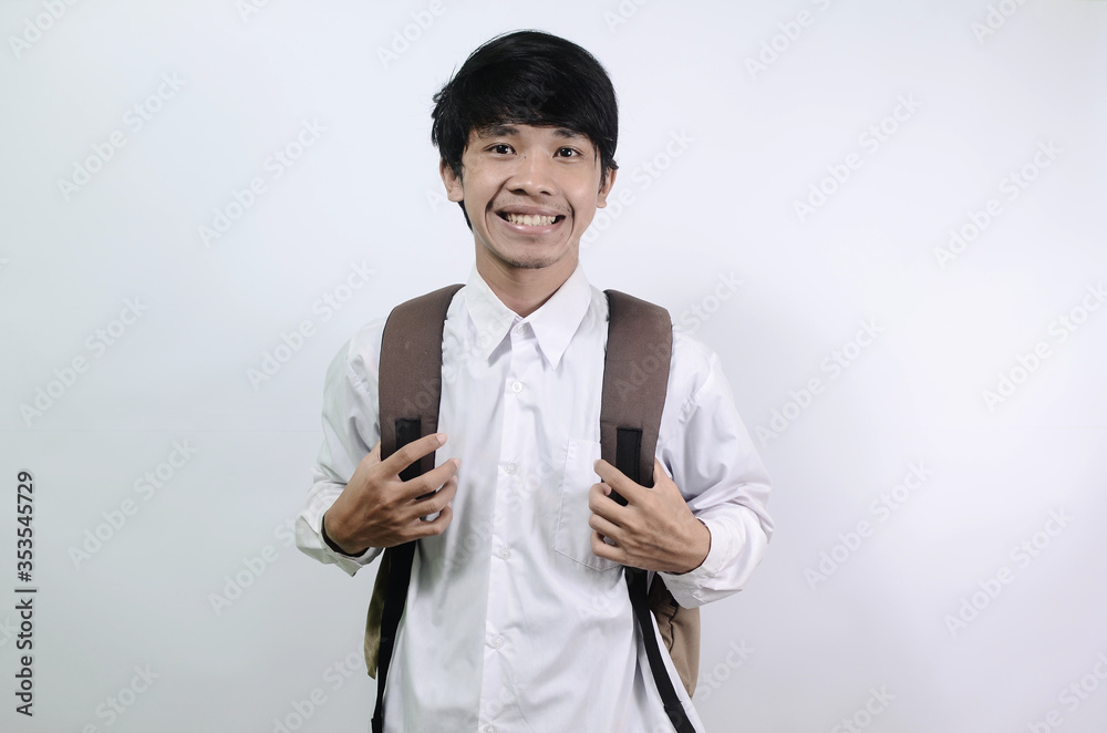 Young Asian men wearing white shirts and carrying bags isolated on a white background. Man's expression is cheerful and full of enthusiasm
Young Asian men wearing white shirts and carrying bags isolated on a white background. Man's expression is cheerful and full of enthusiasm