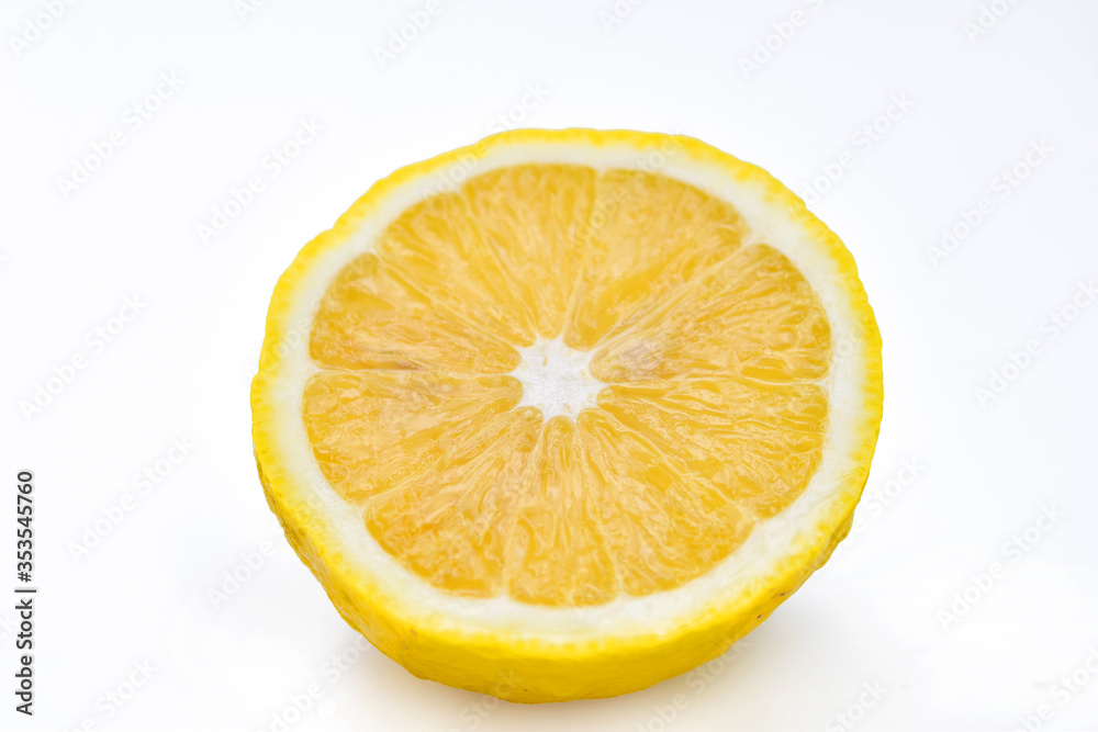 Half yellow lemon citrus fruit isolated on white background Half yellow lemon citrus fruit isolated on white background