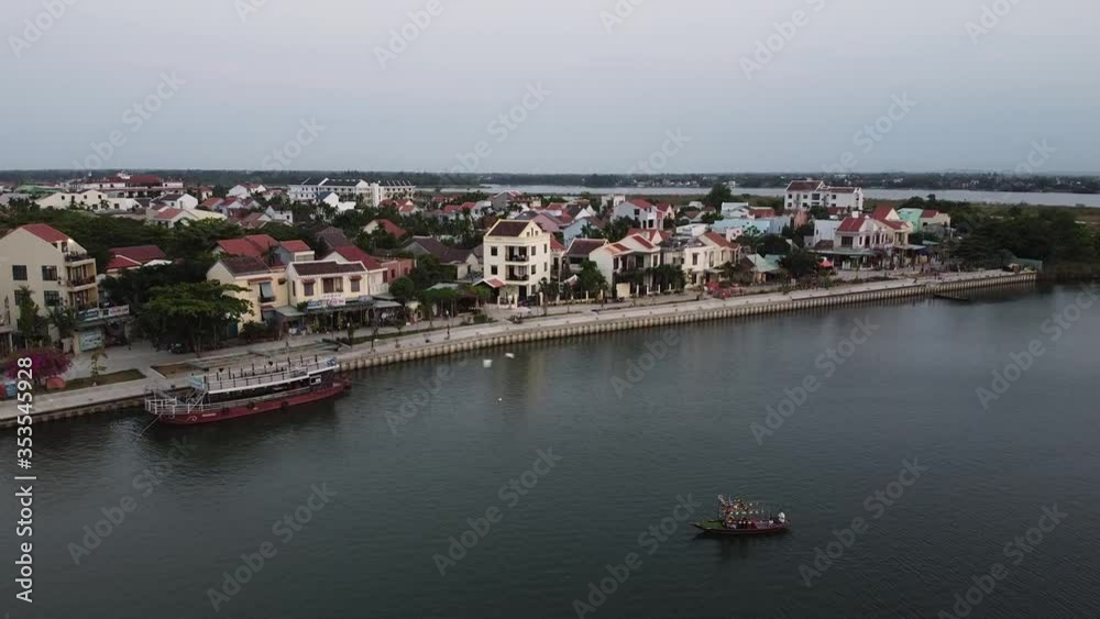 Aerial view of peaceful Hoi An Town in Vietnam and the historical Thu Bon river. Aerial view of peaceful Hoi An Town in Vietnam and the historical Thu Bon river.