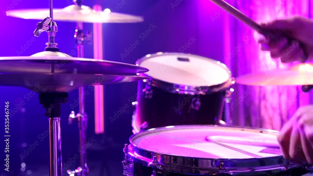 A drummer is drumming in the Studio. The musician behind the drum kit. Static video recording. A drummer is drumming in the Studio. The musician behind the drum kit. Static video recording.