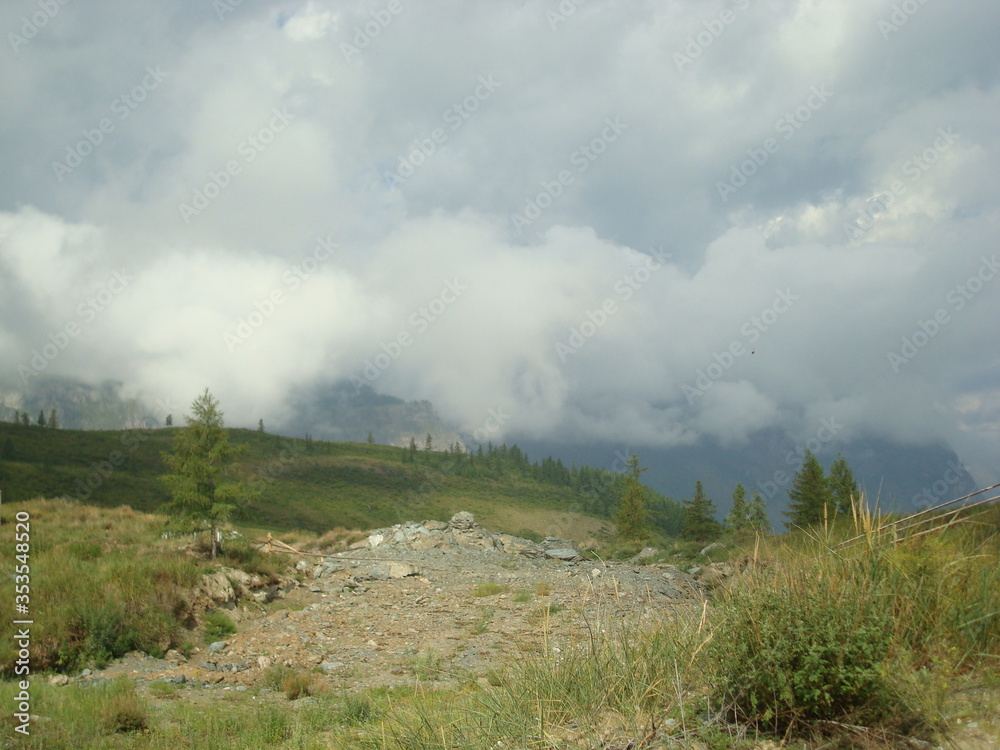 View from the mountain to the clouds below View from the mountain to the clouds below