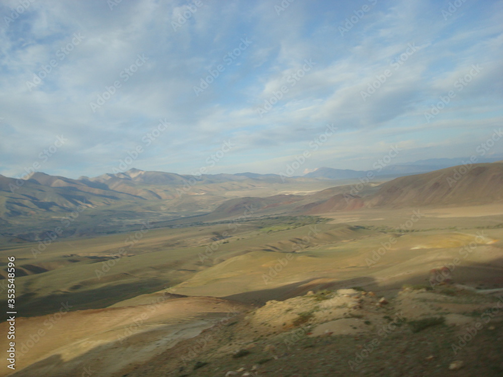 Altai valley in the summer with mountains and clouds