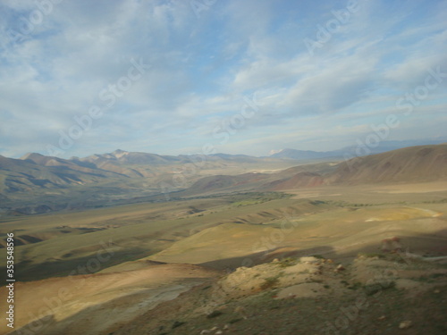 Altai valley in the summer with mountains and clouds