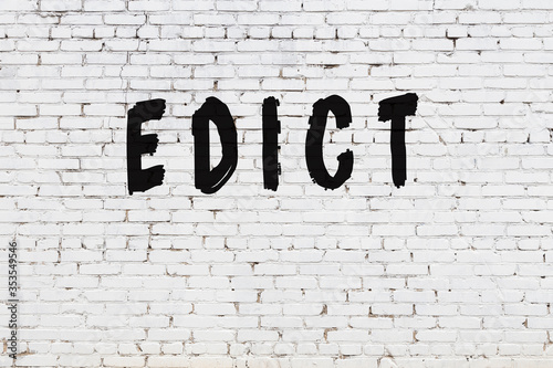 Fényképezés Word edict painted on white brick wall