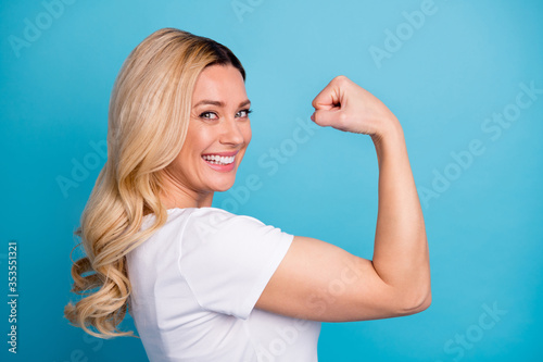 Leinwand Poster Closeup profile photo of attractive lady wavy blond hairdo raise arm showing big