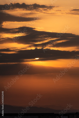 Fototapeta Naklejka Na Ścianę i Meble -  Dramatic Sunrise with the sun behind the clouds 