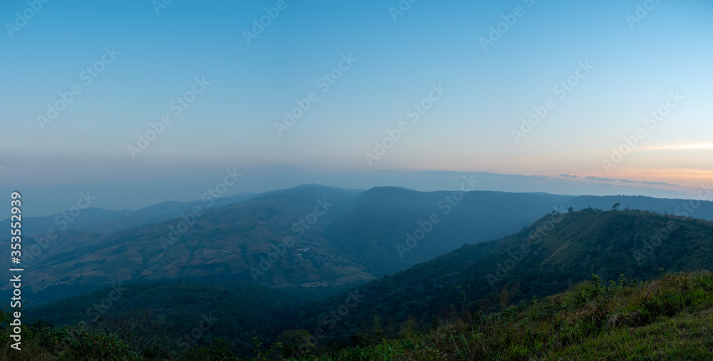 Phu Lom Lo mountains and valley, panoramic view, evening light with fog.
