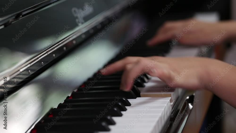 Hands of people playing piano Hands of people playing piano