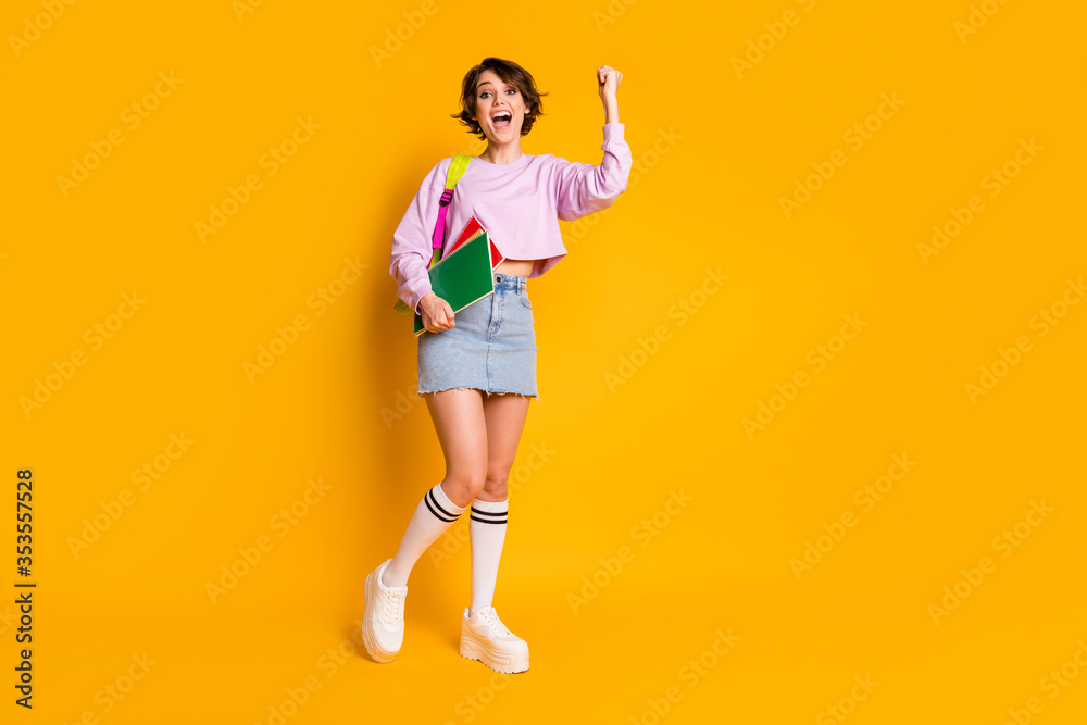Full length body size view of her she nice attractive lovely cheerful cheery girl holding in hand materials celebrating a-mark holiday isolated on bright vivid shine vibrant yellow color background - obrazy, fototapety, plakaty 