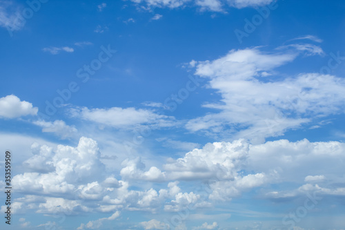 The sky and clouds forming a rainstorm during the day.