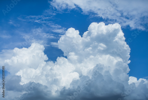 The sky and clouds forming a rainstorm during the day.