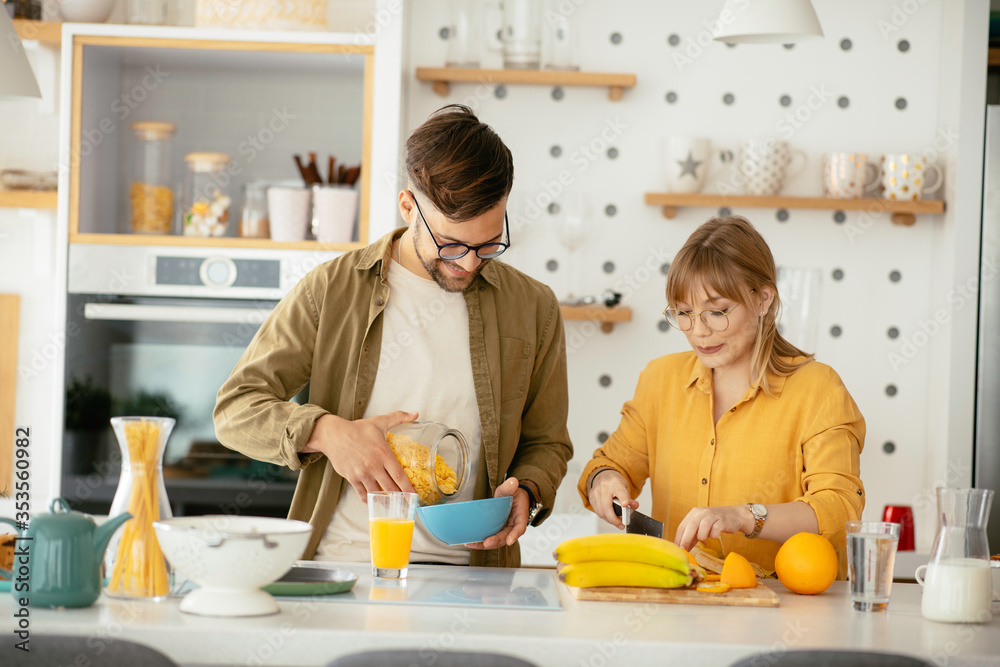 Young couple making breakfast at home. Boyfriend and girlfriend enjoying in morning..
Young couple making breakfast at home. Boyfriend and girlfriend enjoying in morning..