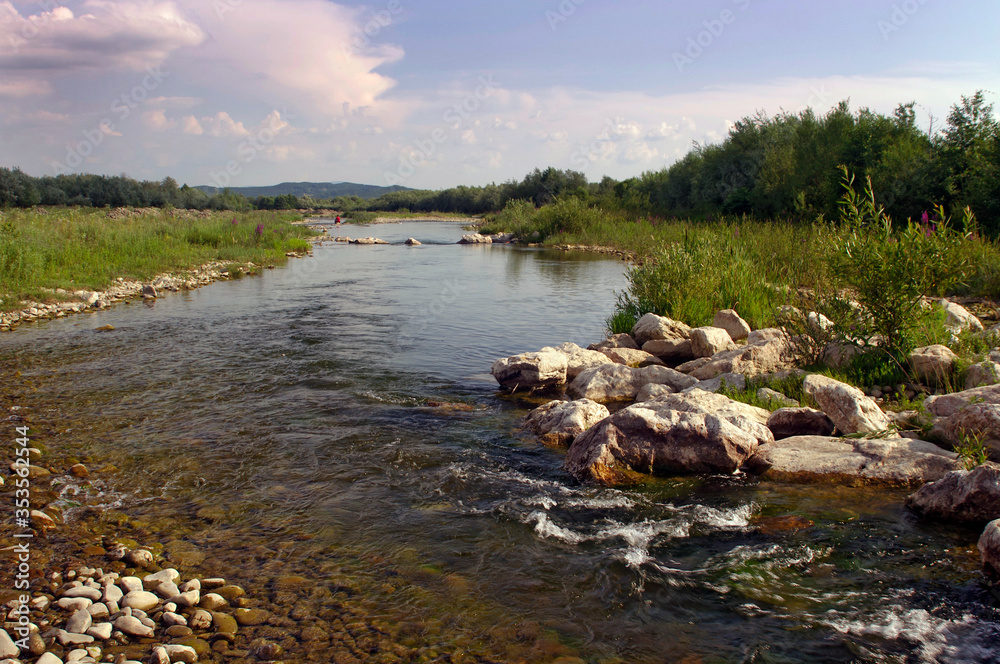 landscape with mountain river and cumulus clouds on a summer day before rain landscape with mountain river and cumulus clouds on a summer day before rain