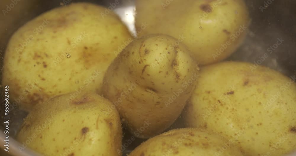 Close up of boiling skinned potatoes in a cooking pot Close up of boiling skinned potatoes in a cooking pot