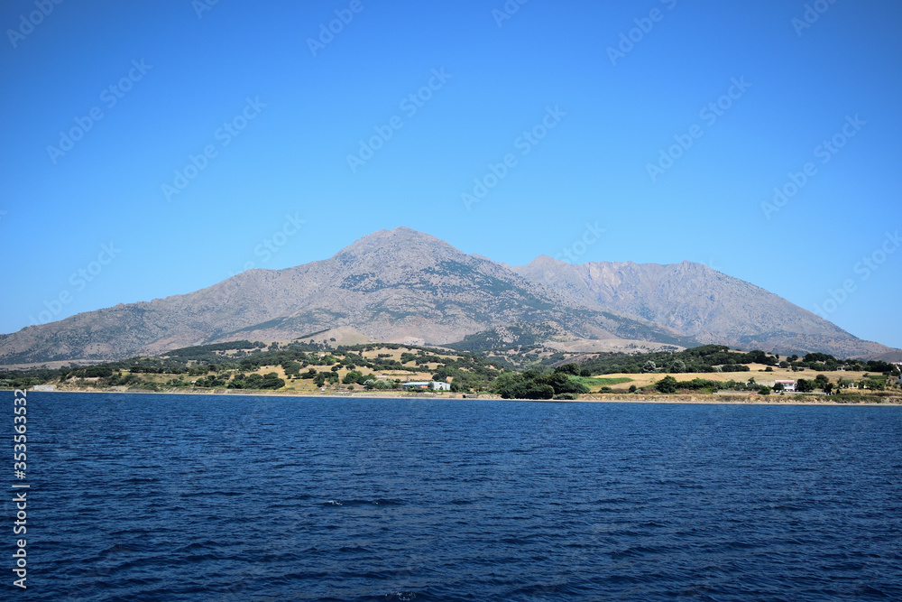 Seascape with Saos mountain and coastline Kamariotissa area - Samothraki island view from ferry - Greece, Aegean sea