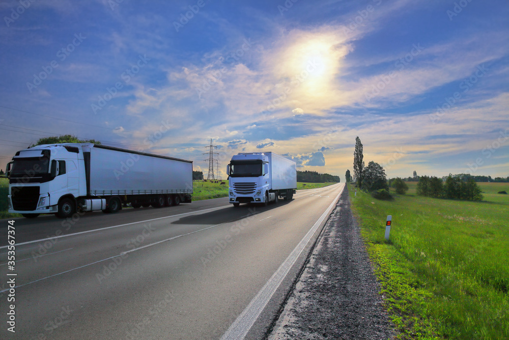 White truck transport on the road at sunset and cargo