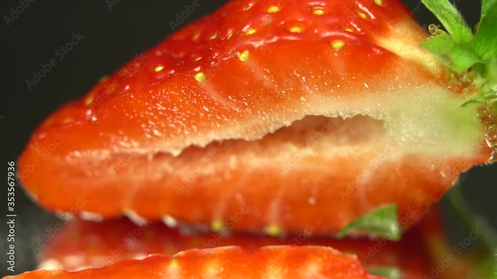 Cut half of strawberry by knife, close up to half cut of strawberry. Macro shooting Cut half of strawberry by knife, close up to half cut of strawberry. Macro shooting