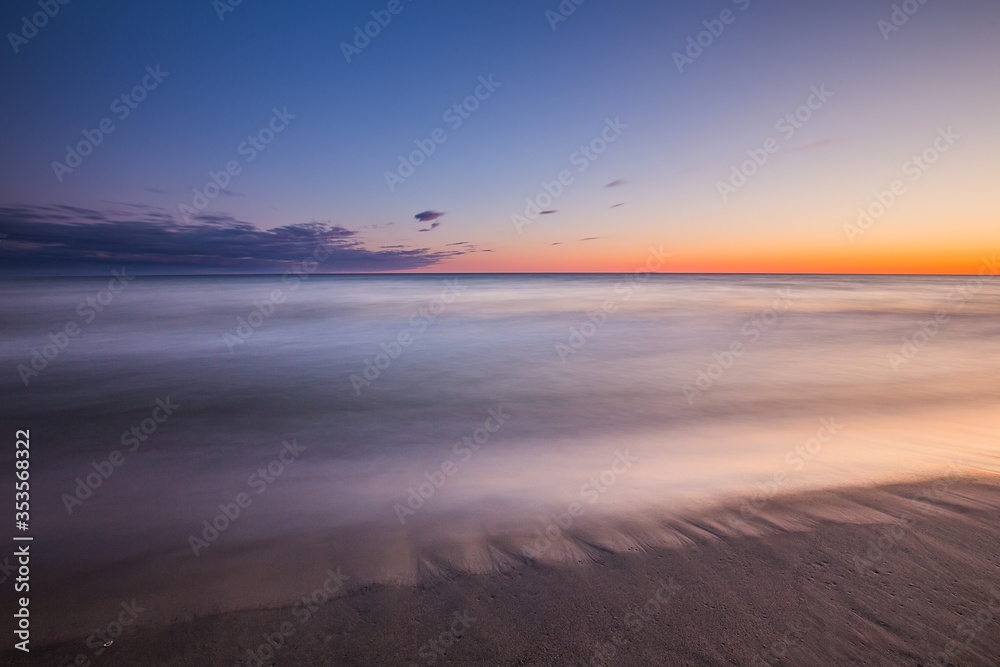 Fototapeta premium Travel photography of the Baltic sea coastline.Amazing sunrise over the Sea. Jastrzebia Gora, Poland.