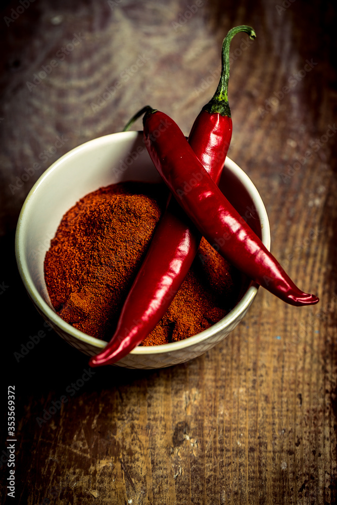 Dry red chilli pepper on wooden table