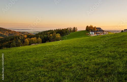 Peaceful autumn Alps mountain lake with clear transparent water and reflections. Sunrise view to Traunsee lake  Gmundnerberg  Altmunster am Traunsee  Upper Austria.