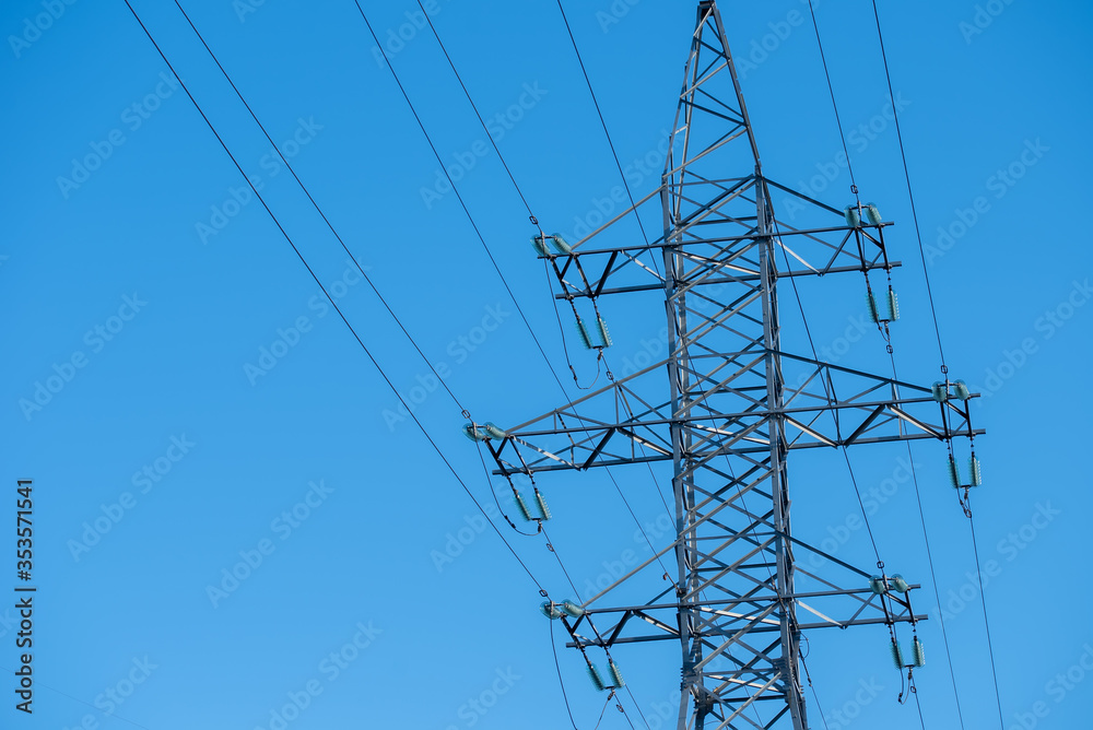 Power line towers against of the blue sky Power line towers against of the blue sky