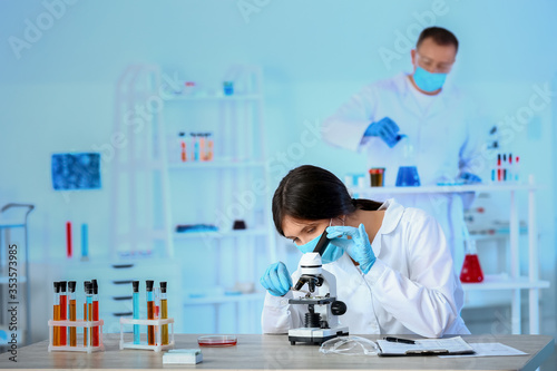 Scientist working with micr...