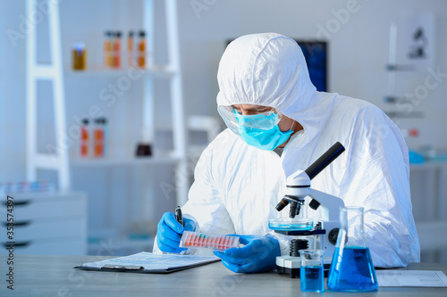 Scientist working with micr...